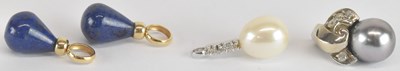 Lot 1512 - Two yellow metal mounted lapis lazuli pendants,...