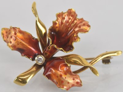 Lot 1534 - An 18ct yellow gold diamond set red enamelled...