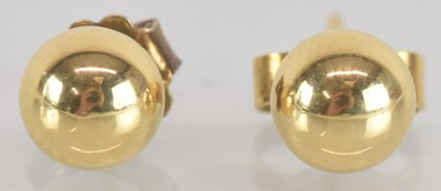 Lot 1515 - A pair of 18ct yellow gold ear studs, combined...