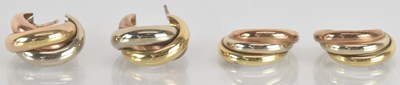 Lot 1492 - Two pairs of 9ct tricolour gold twist earrings,...