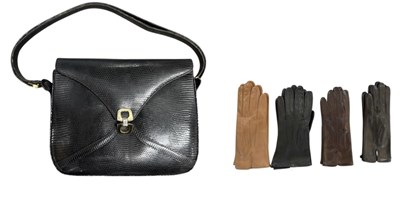 Lot 569 - NOUNELTA; an Italian snakeskin effect black...