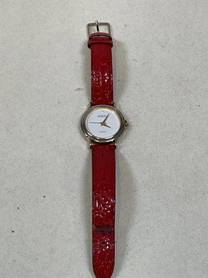 Lot 612 - GUCCI; a lady's two tone stainless steel...