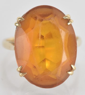 Lot 1365 - A 9ct yellow gold orange stone set dress ring,...