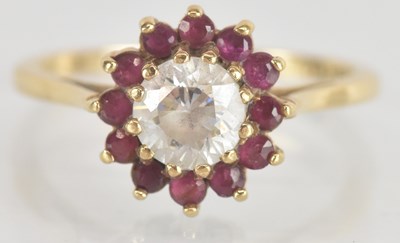 Lot 1316 - A 9ct yellow gold white stone and ruby cluster...