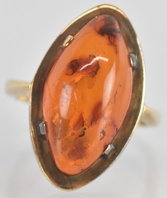 Lot 1317 - A 9ct yellow gold amber set ring, the lozenge...