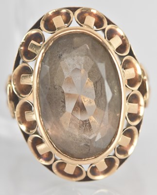 Lot 1241 - A yellow metal citrine set dress ring, the...