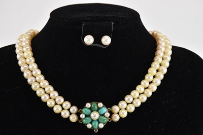Lot 1452 - A cultured pearl two strand necklace, with...