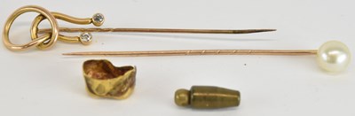 Lot 1545 - A yellow metal diamond set twist effect stick...