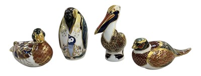 Lot 627 - ROYAL CROWN DERBY; four porcelain paperweights...