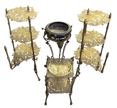 Lot 65 - A pair of early 20th century brass three tier...