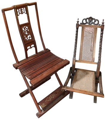 Lot 92 - A late Victorian walnut bergère seated folding...