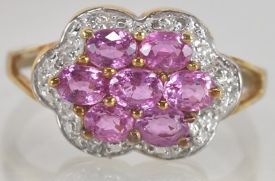 Lot 1326 - A modern cluster ring with pink stone set...