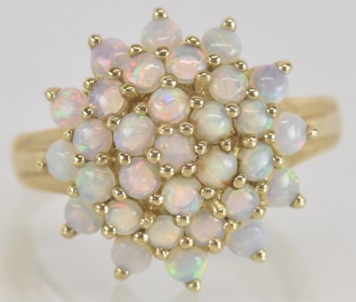 Lot 1327 - A 9ct gold opal cluster dress ring, size Q,...