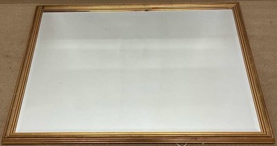 Lot 564 - A modern gilt framed rectangular wall mirror...