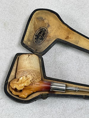 Lot 62 - A long 19th century cased carved Meerschaum...