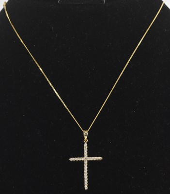 Lot 1456 - A 9ct gold diamond encrusted cross pendant,...