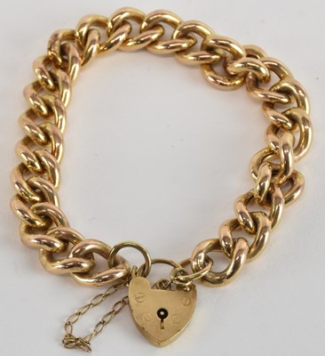 Lot 1580 - A 9ct gold bracelet, with 9ct gold heart...