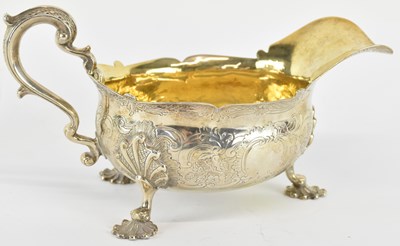 Lot 1036 - A George III hallmarked silver sauceboat of...