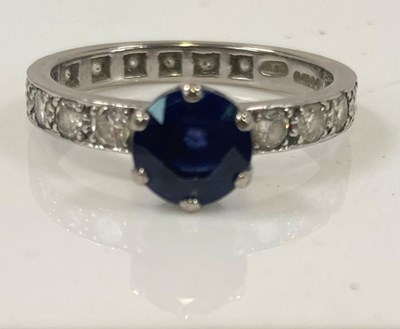 Lot 457 - An 18ct white gold sapphire and diamond full...