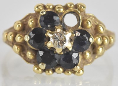 Lot 1275 - An 18ct yellow gold diamond and sapphire set...