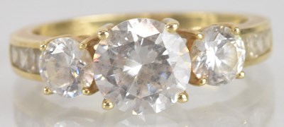 Lot 1287 - A 14ct yellow gold clear glass three stone...