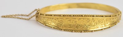 Lot 1601 - A 9ct yellow gold snap bangle, diameter approx...