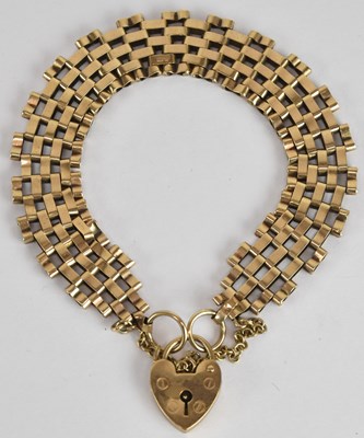 Lot 1594 - A 9ct yellow gold gate link bracelet, with...