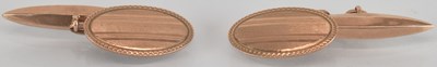 Lot 1527 - A pair of 9ct yellow gold oval cufflinks, with...