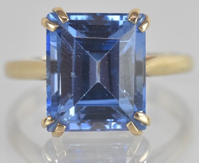 Lot 1333 - A 9ct yellow gold blue topaz set single stone...