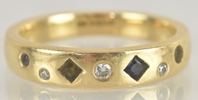 Lot 1331 - A 9ct yellow gold sapphire and diamond set...