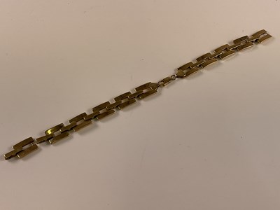 Lot 524 - A yellow metal open link bracelet, one link...