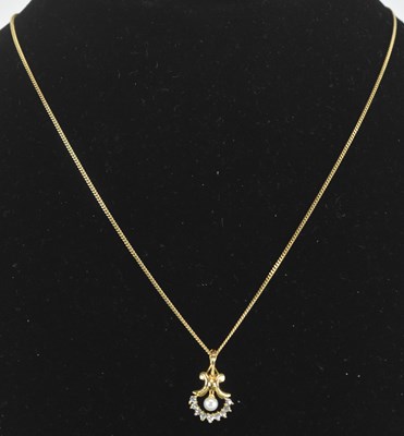 Lot 1450 - A 9ct yellow gold seed pearl and diamond set...