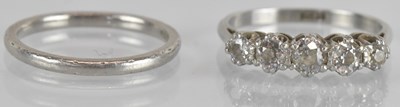 Lot 1270 - A platinum diamond five stone ring, size K/L,...