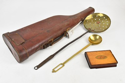 Lot 1287 - An inlaid puzzle box, two brass implements and...