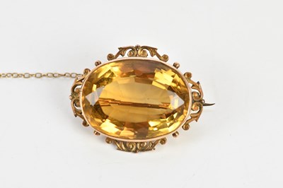 Lot 1600 - A 9ct yellow gold and citrine brooch, approx...