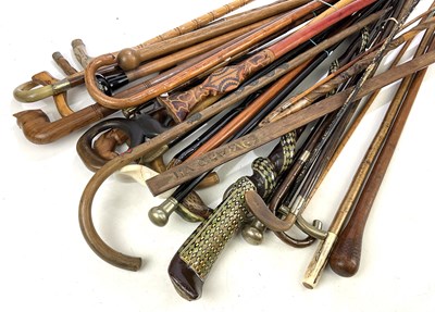 Lot 1253 - A large collection of walking sticks,...