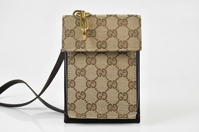 Lot 180 - GUCCI; a tan brown cloth monogram and dark...