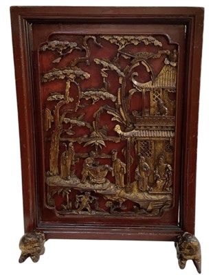 Lot 817 - A Chinese carved hardwood red lacquered gilt...