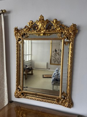 Lot 683 - An ornate 19th century giltwood wall mirror...