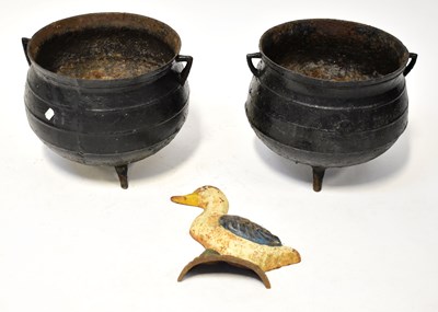 Lot 140 - Two cast iron cauldrons raised on three...