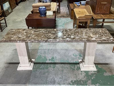 Lot 684 - A marble long table and raised on two column...