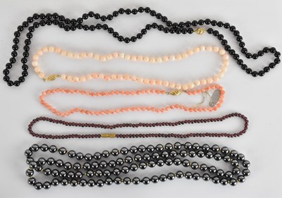 Lot 1628 - Five assorted bead necklaces comprising a...