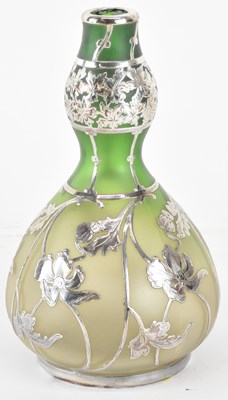 Lot 1179 - An Art Nouveau silver overlaid glass vase of...