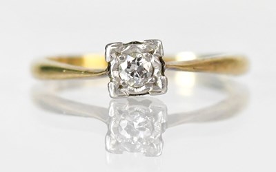 Lot 801 - A yellow metal ring set with an approx. 0.15ct...