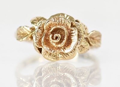 Lot 786 - A 9ct yellow gold ring set with a rose and...