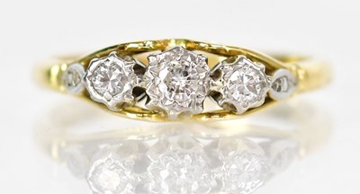 Lot 760 - An 18ct yellow gold ring set with three...