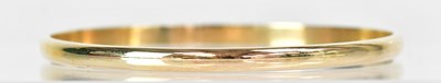 Lot 823 - A plain yellow metal bangle, unmarked.