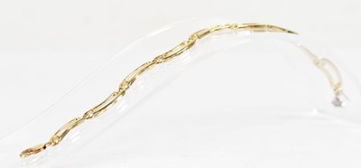 Lot 816 - A 9ct yellow gold curved link bracelet, length...