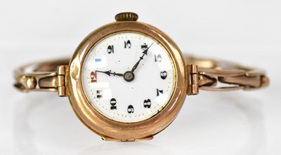 Lot 1014 - A 9ct rose gold wristwatch, the white...