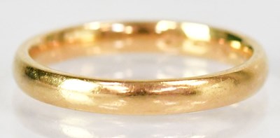 Lot 740 - An 18ct yellow gold wedding band, size Q,...